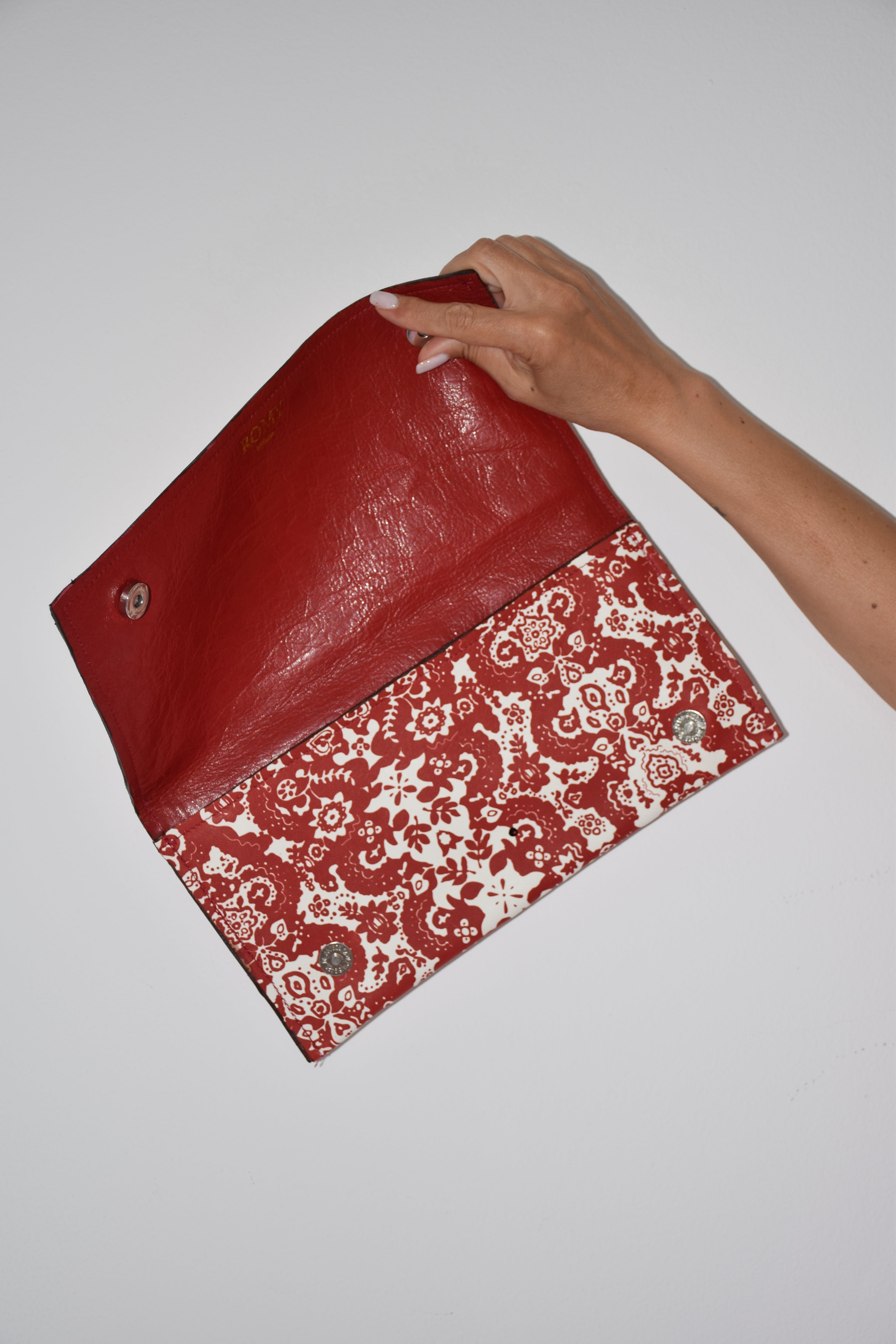 Clutch fantasia rosso e bianco