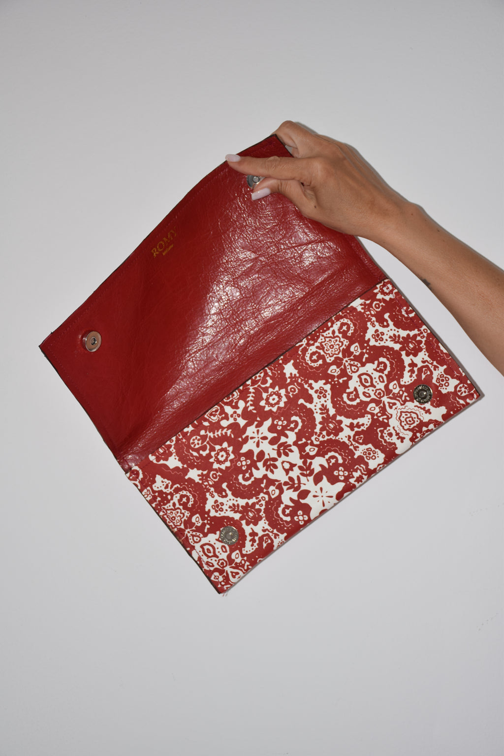 Clutch fantasia rosso e bianco
