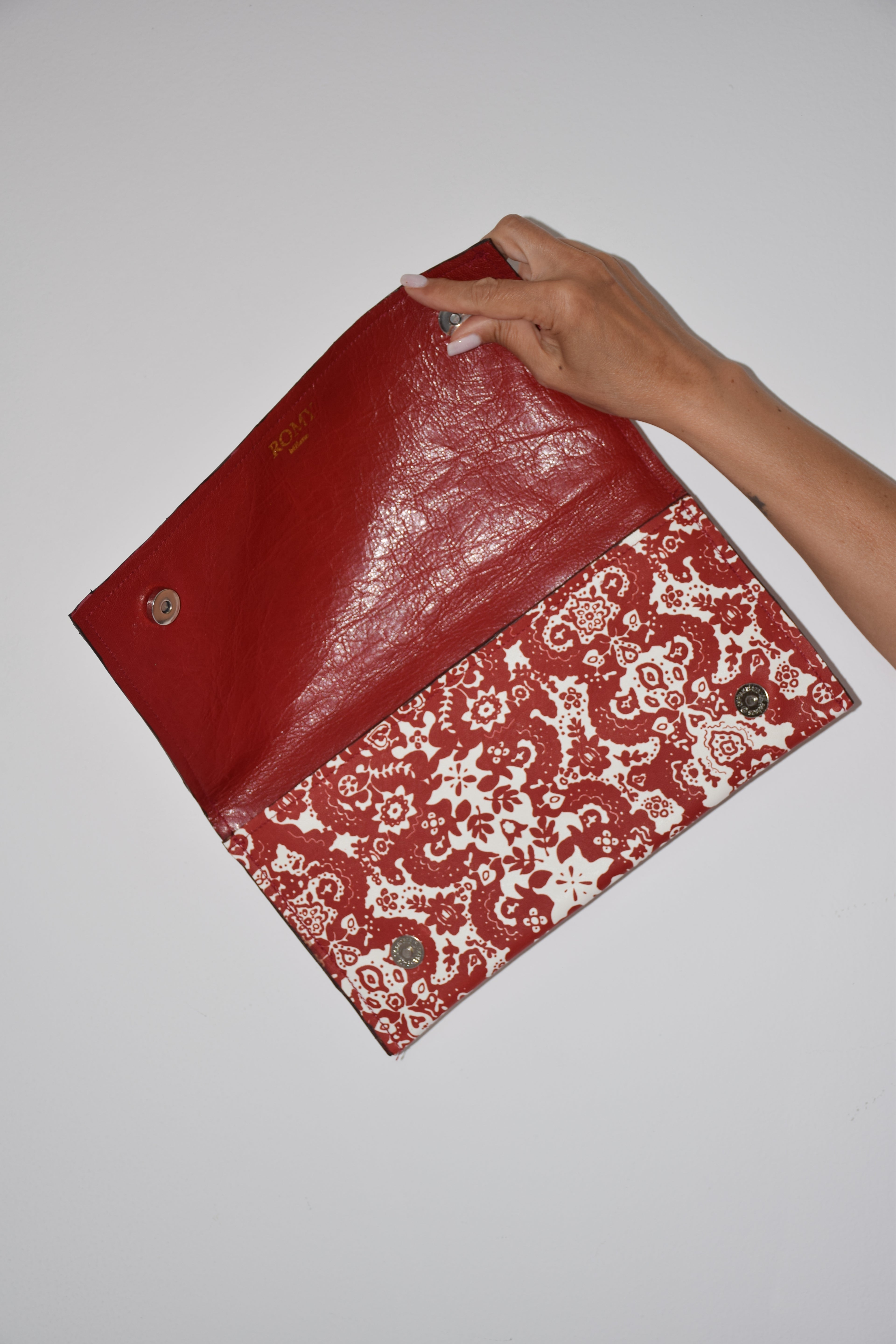 Clutch fantasia rosso e bianco