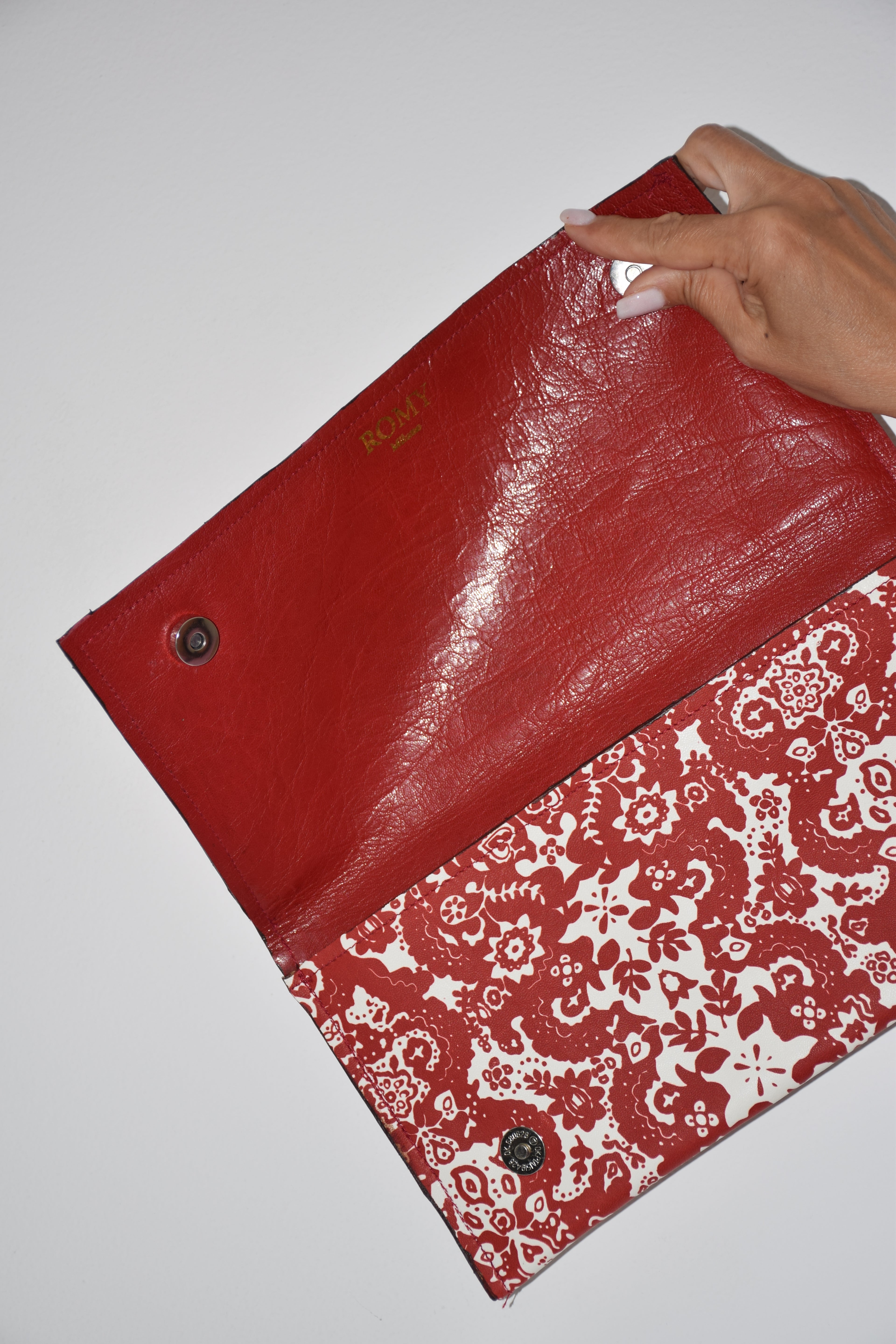 Clutch fantasia rosso e bianco