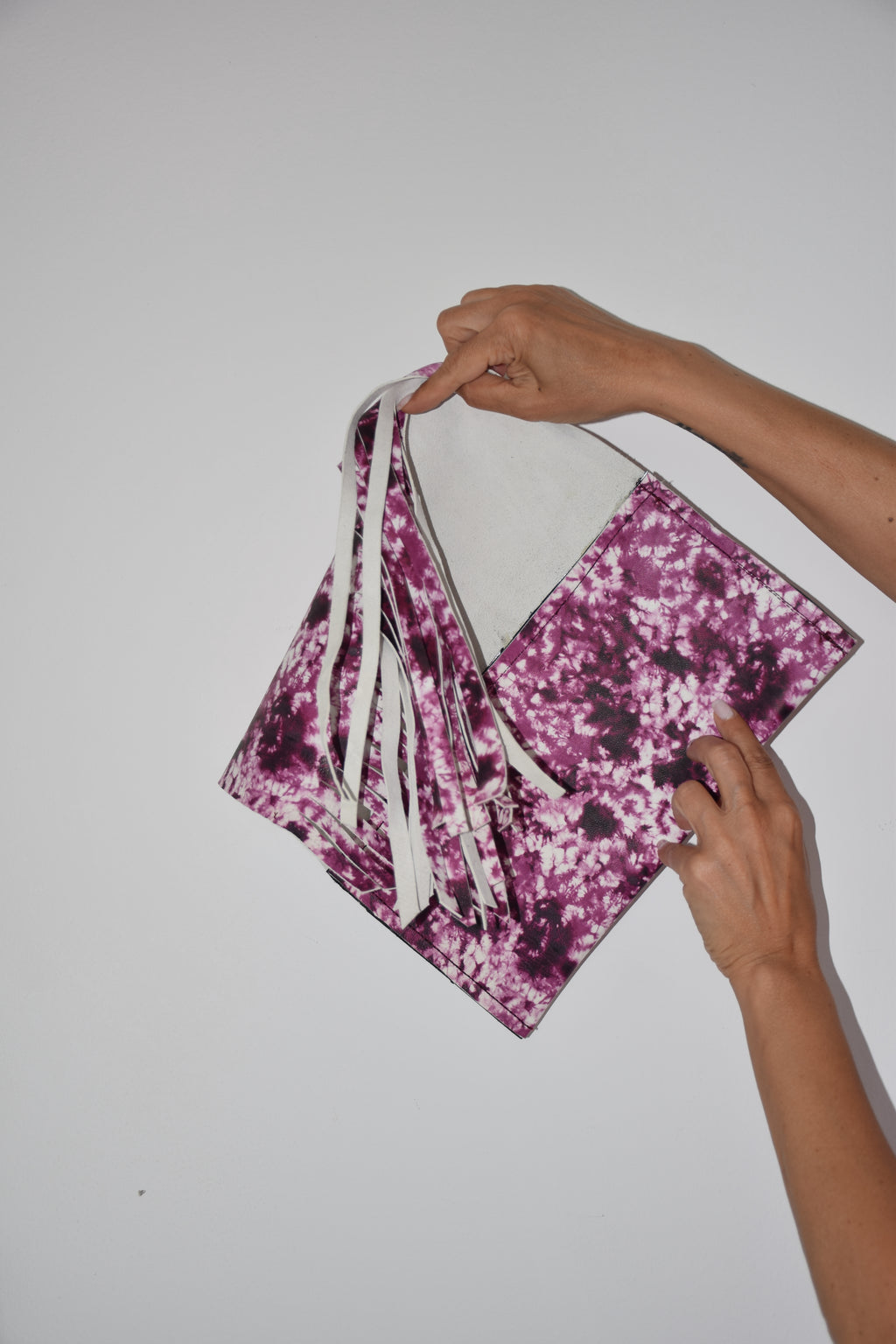 Clutch fantasia con frangie